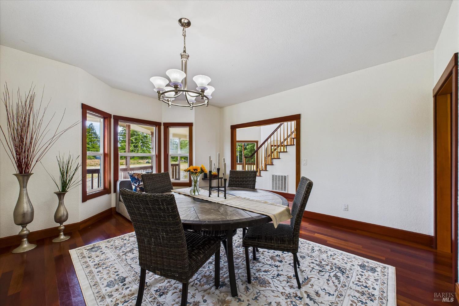 1150 Dinsmore Ranch Road Rio Dell, CA 95562 - Photo 21 of 71 a view of a dining room with furniture window and wooden floor