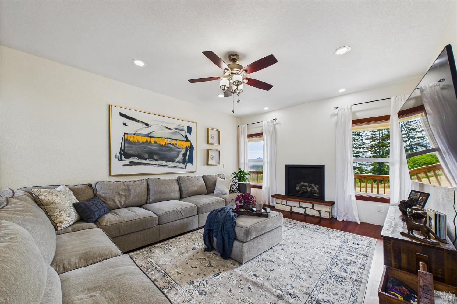 1150 Dinsmore Ranch Road Rio Dell, CA 95562 - Photo 22 of 71 a living room with furniture flat screen tv and a large window