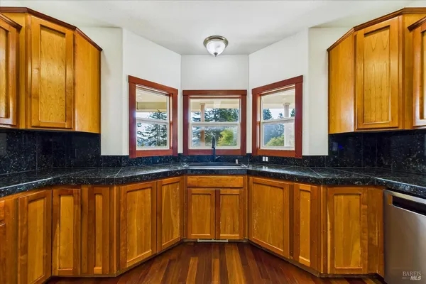aerial view of a house with a big yard