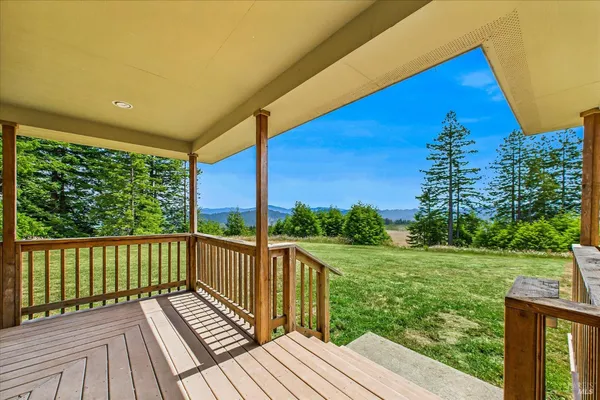 a bedroom with a large bed and a large window