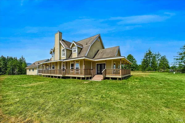 a bathroom with a granite countertop sink a mirror a bathtub and shower