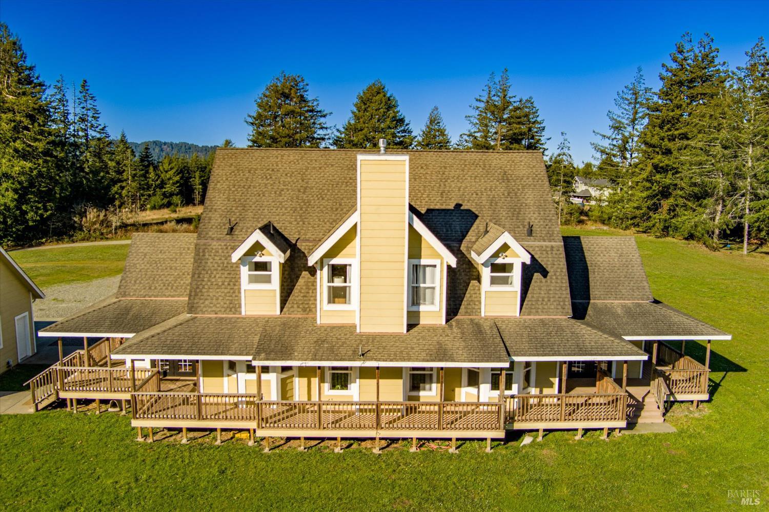 1150 Dinsmore Ranch Road Rio Dell, CA 95562 - Photo 40 of 71 aerial view of a house with a big yard