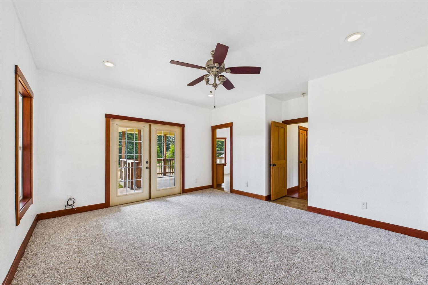 1150 Dinsmore Ranch Road Rio Dell, CA 95562 - Photo 41 of 71 a view of a livingroom with a chandelier fan and windows