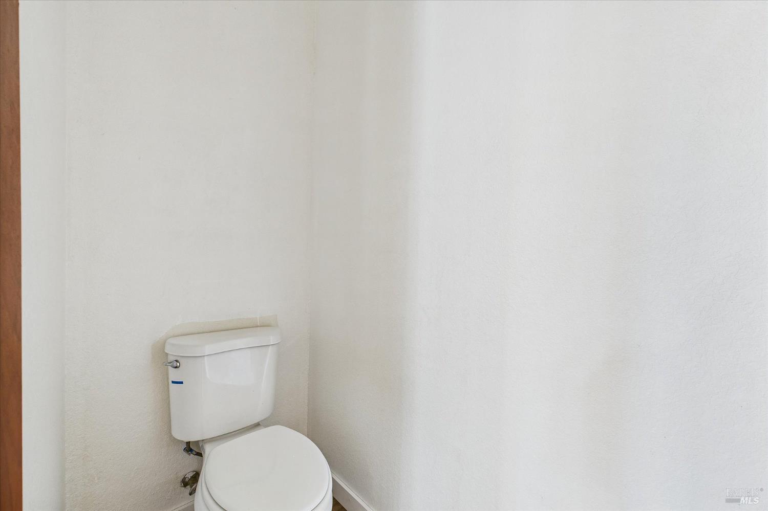 1150 Dinsmore Ranch Road Rio Dell, CA 95562 - Photo 45 of 71 a white toilet sitting next to a white wall