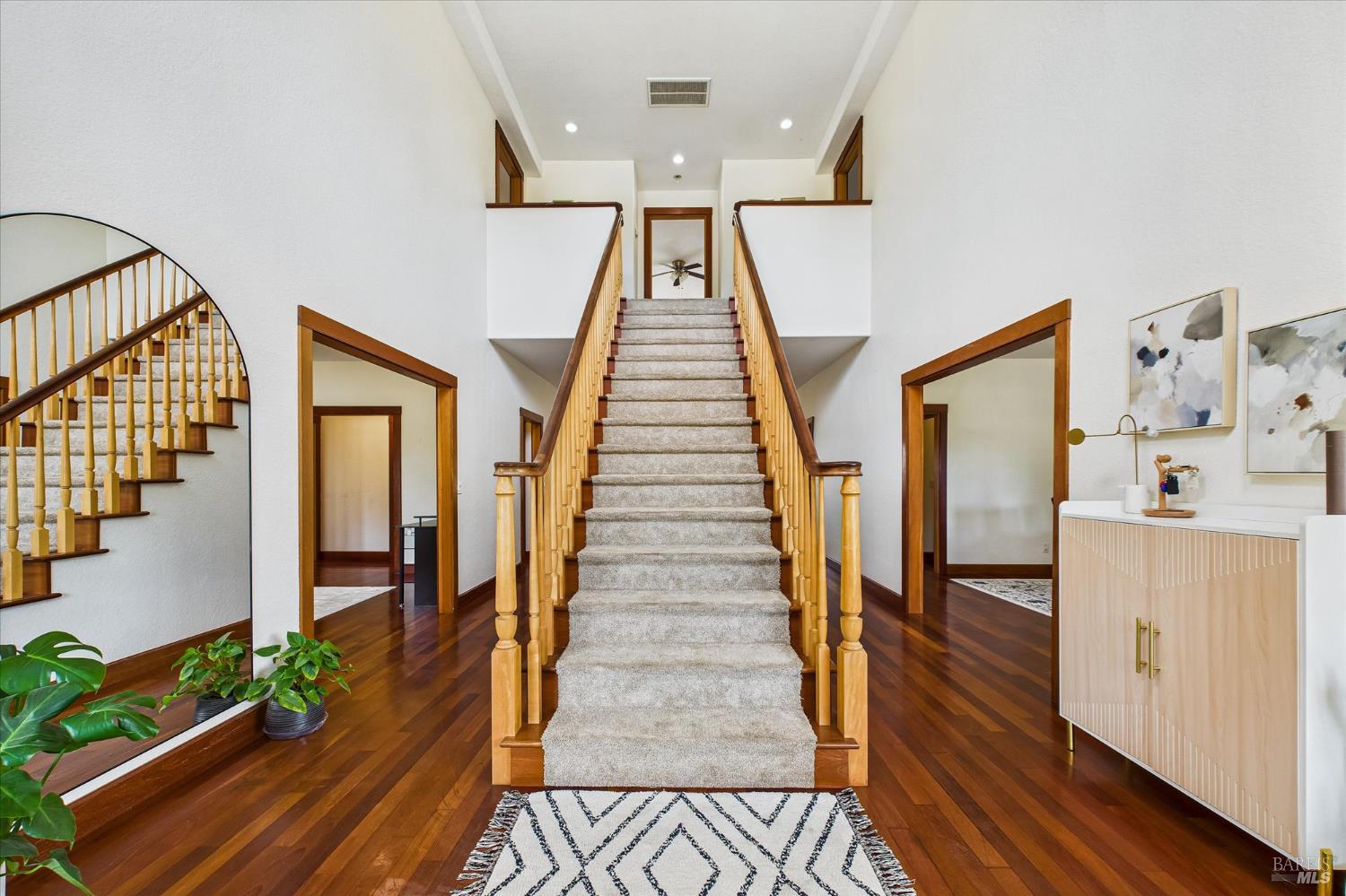 1150 Dinsmore Ranch Road Rio Dell, CA 95562 - Photo 46 of 71 a view of a hallway with wooden floor and staircase