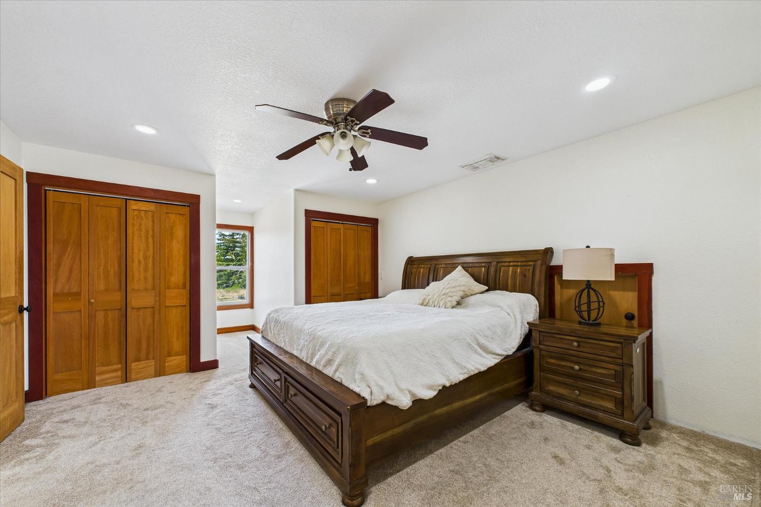 1150 Dinsmore Ranch Road Rio Dell, CA 95562 - Photo 55 of 71 a bedroom with a bed and a chandelier