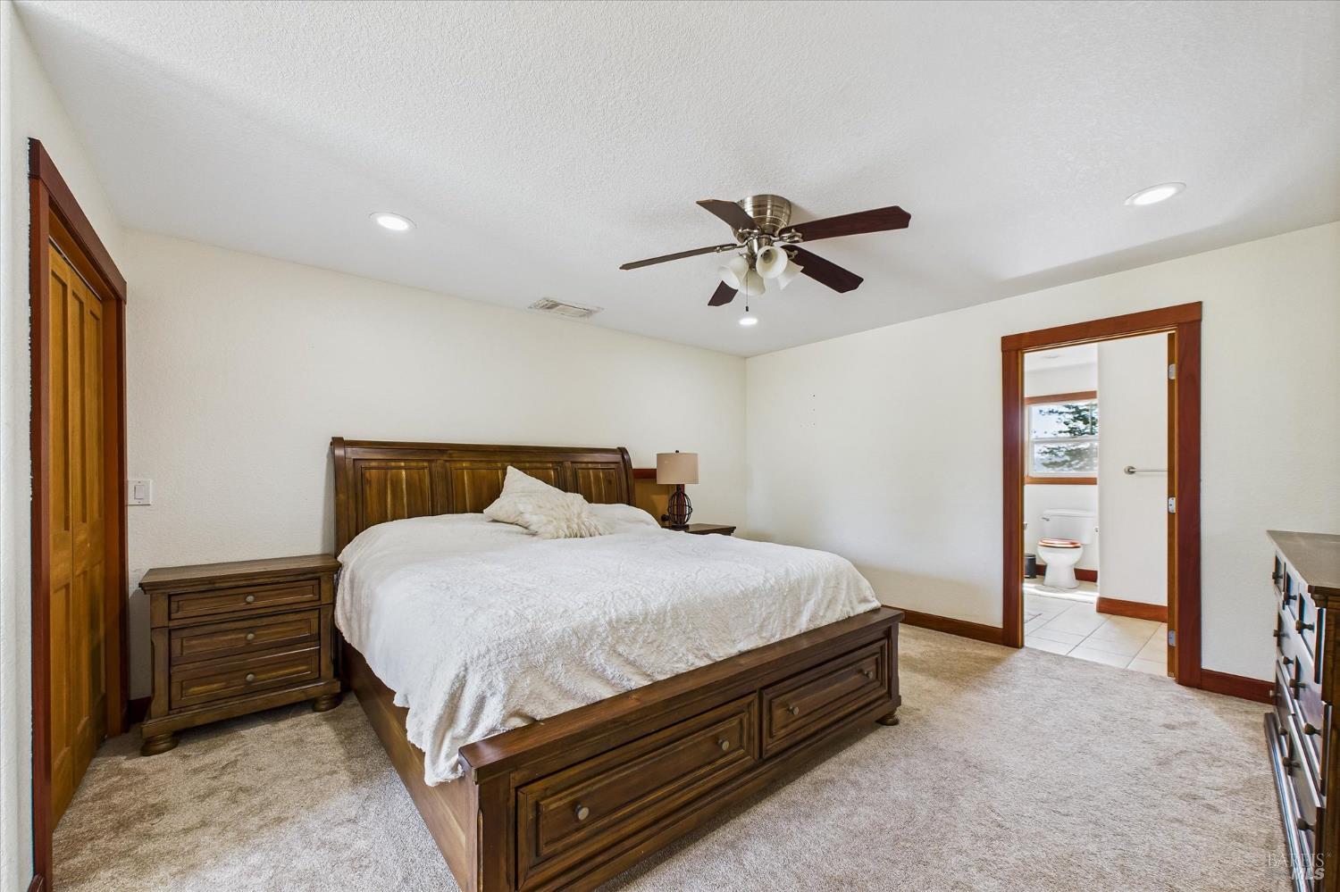 1150 Dinsmore Ranch Road Rio Dell, CA 95562 - Photo 56 of 71 a bedroom with a bed and a chandelier
