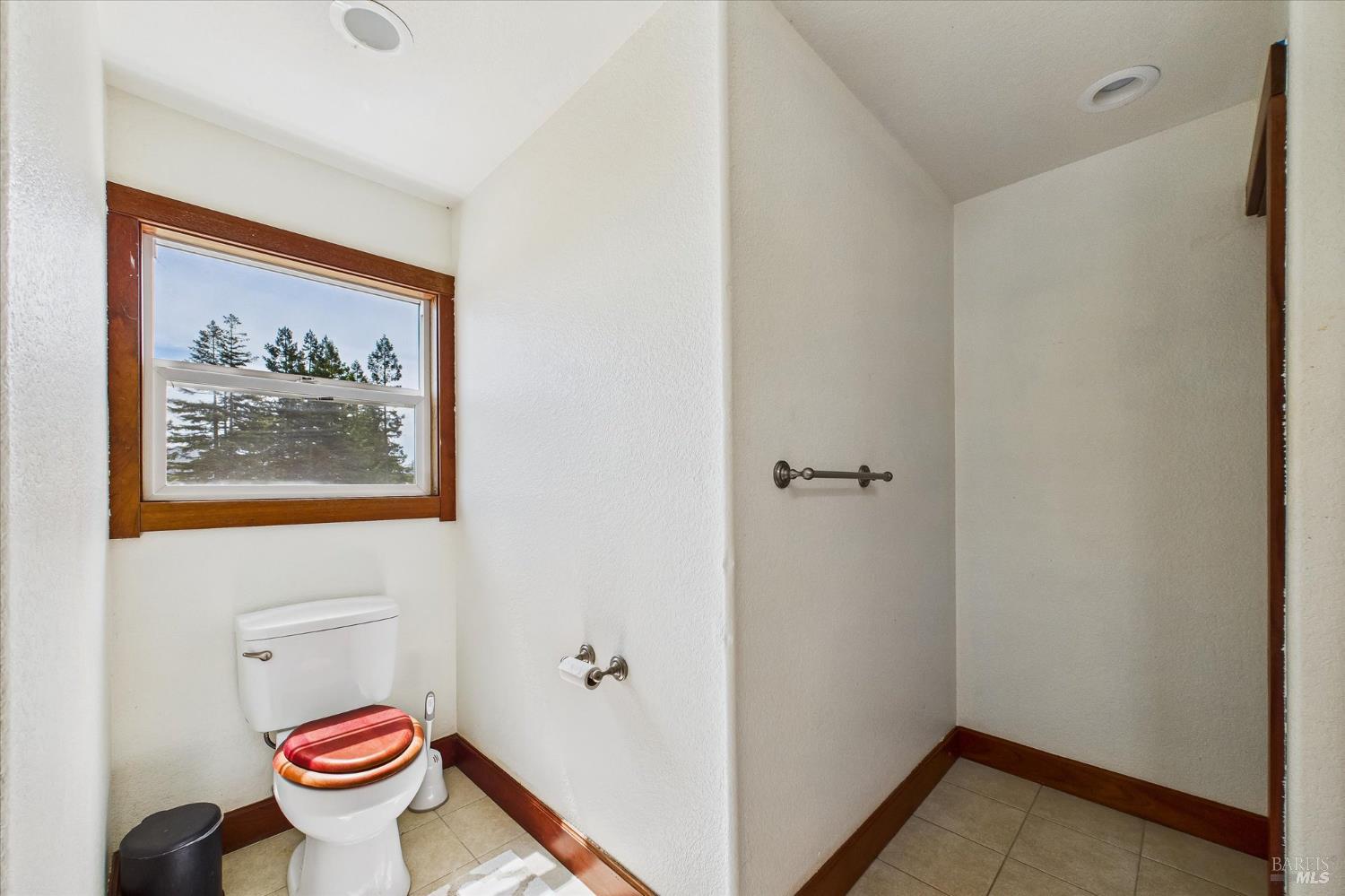 1150 Dinsmore Ranch Road Rio Dell, CA 95562 - Photo 58 of 71 a bathroom with a toilet and a shower curtain