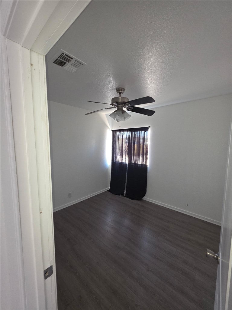 512 E Street Needles, CA 92363 - Photo 15 of 20 a view of wooden floor in an empty room