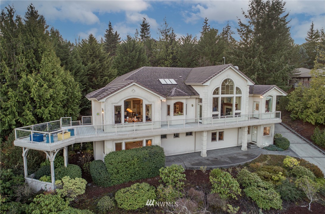 53 Quails Roost Road Sequim, WA 98382 - Photo 1 of 40 a view of house with garden and trees