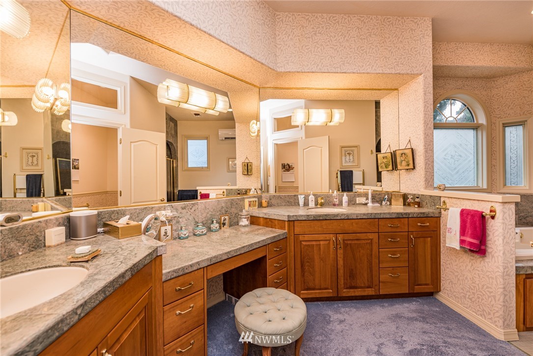 53 Quails Roost Road Sequim, WA 98382 - Photo 24 of 40 a bathroom with a granite countertop sink and a mirror