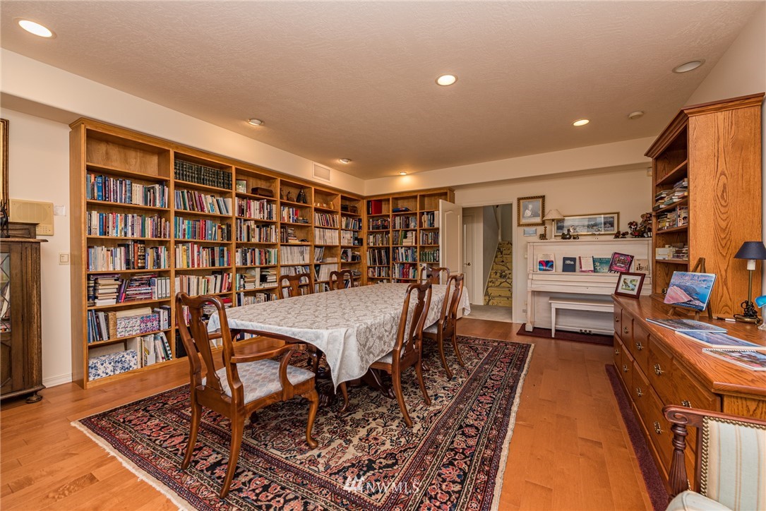 53 Quails Roost Road Sequim, WA 98382 - Photo 27 of 40 a room with furniture and a book shelf
