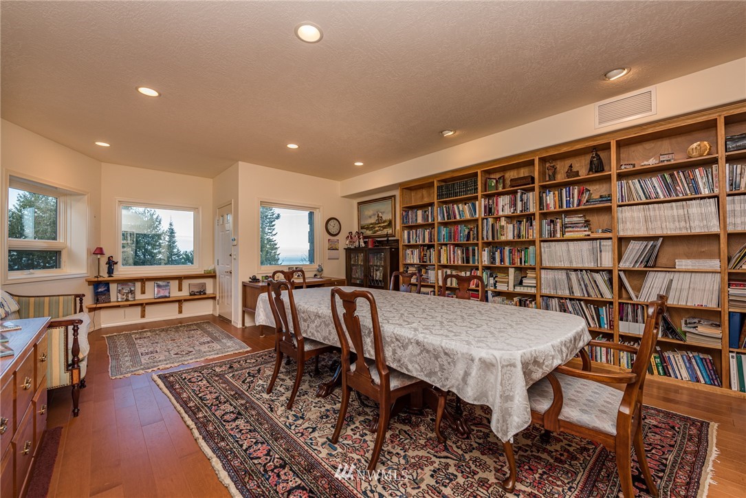 53 Quails Roost Road Sequim, WA 98382 - Photo 28 of 40 a view of a dining room with furniture window and wooden floor
