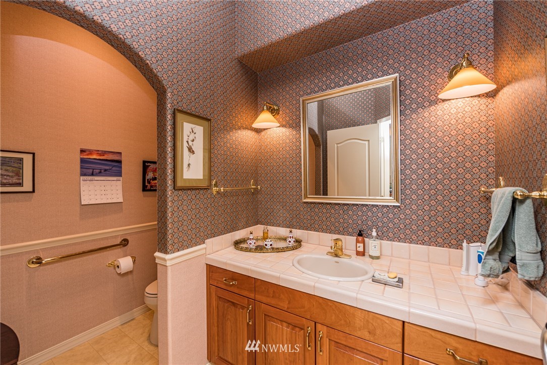 53 Quails Roost Road Sequim, WA 98382 - Photo 32 of 40 a bathroom with a sink vanity and a mirror