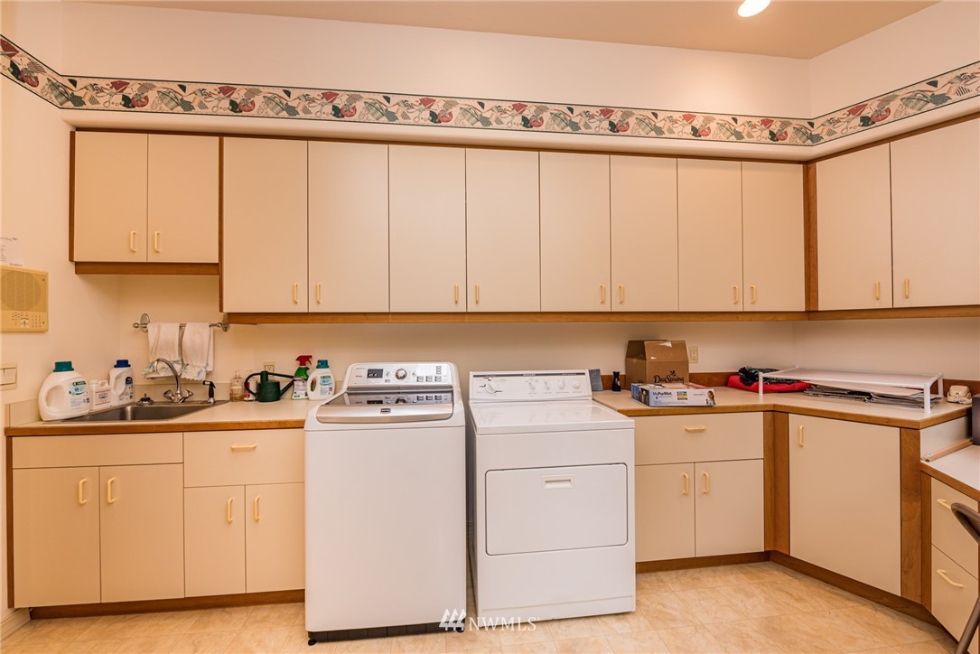 53 Quails Roost Road Sequim, WA 98382 - Photo 37 of 40 a view of a kitchen with sink and cabinets