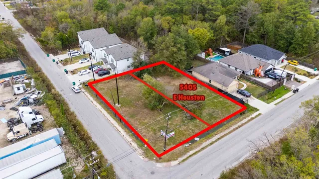 an aerial view of residential building and lake