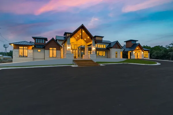 a front view of house with yard and green space
