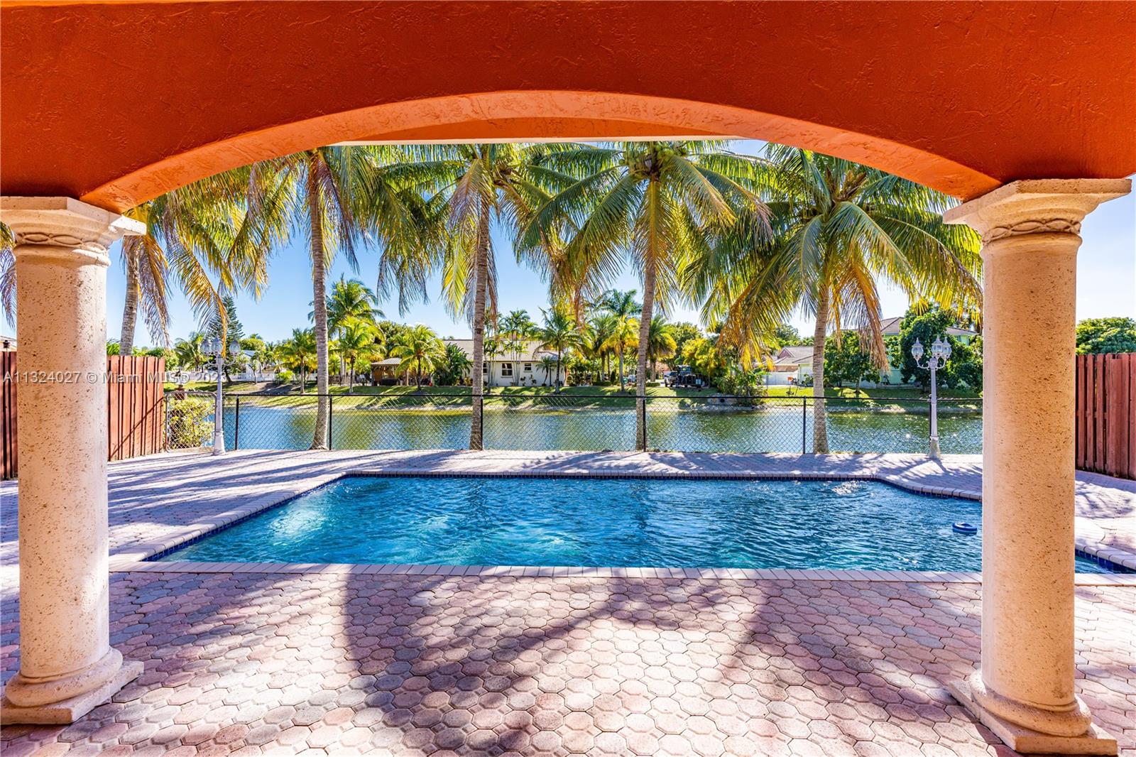 16056 Southwest 66th Terrace Miami, FL 33193 - Photo 17 of 24 a view of swimming pool with a patio