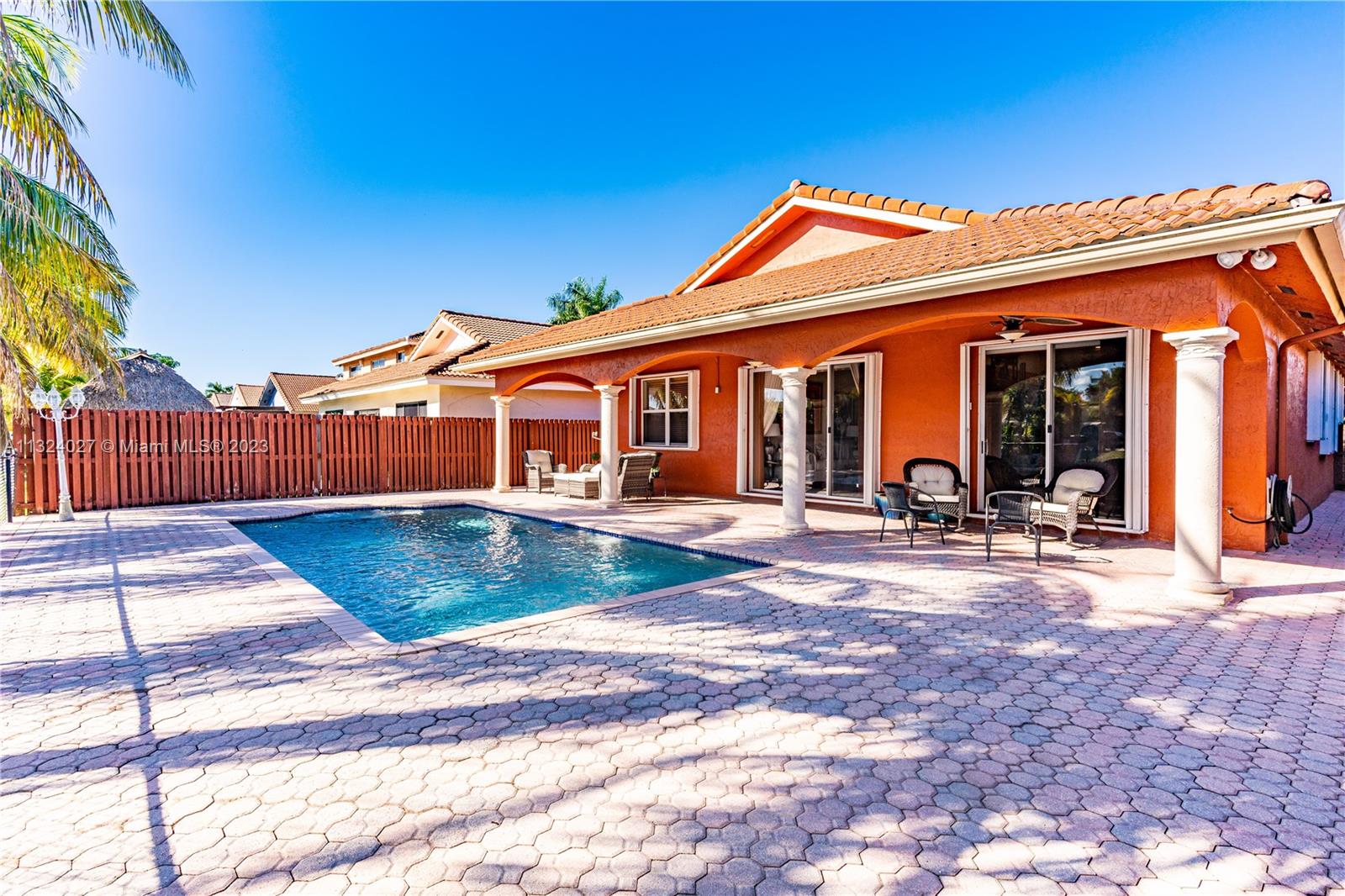 16056 Southwest 66th Terrace Miami, FL 33193 - Photo 20 of 24 a view of a house with backyard and porch