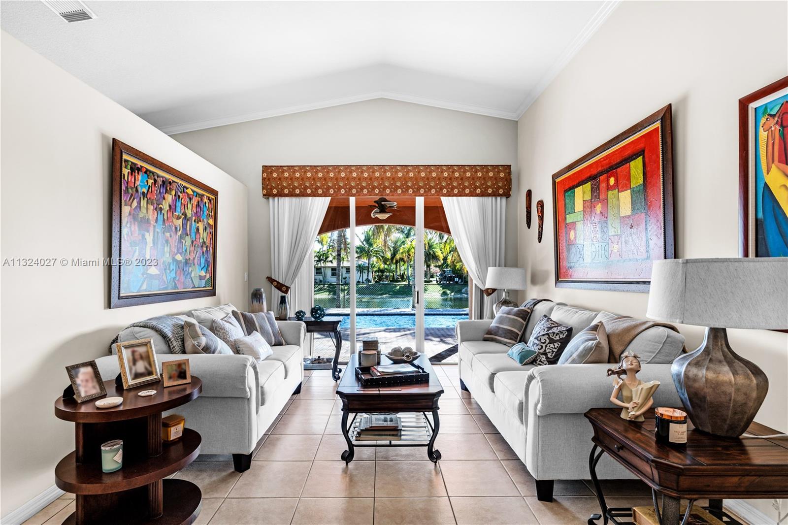 16056 Southwest 66th Terrace Miami, FL 33193 - Photo 4 of 24 a living room with furniture and a large window