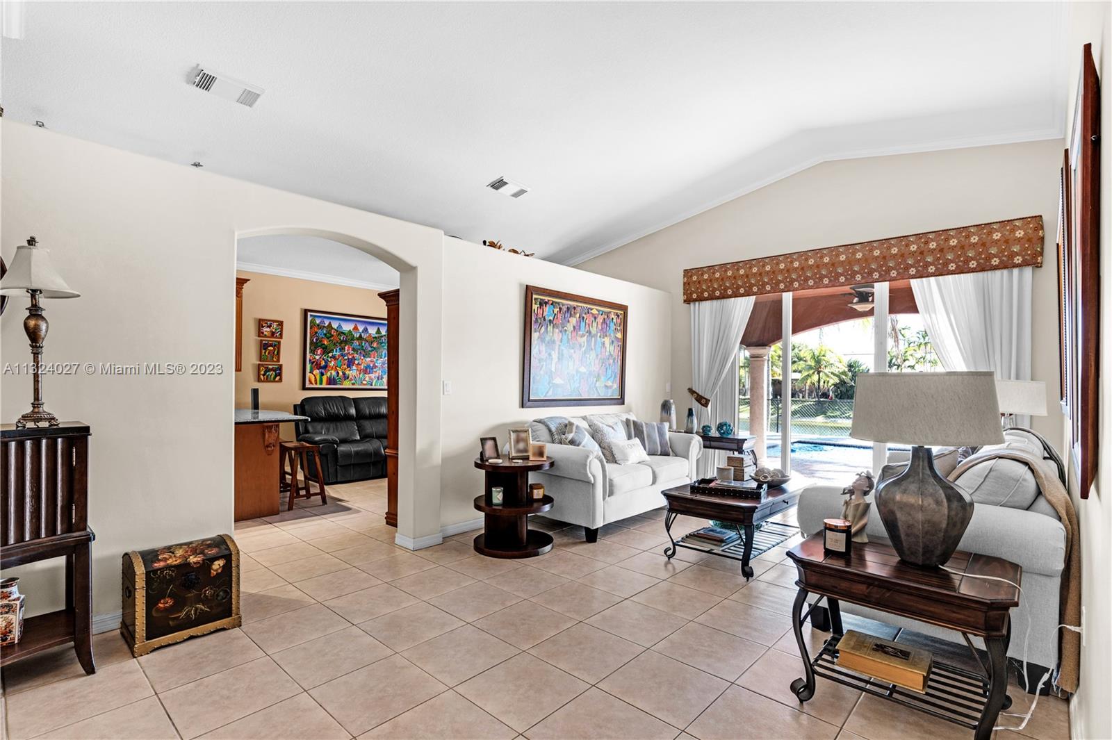 16056 Southwest 66th Terrace Miami, FL 33193 - Photo 6 of 24 a bedroom with furniture and a large window