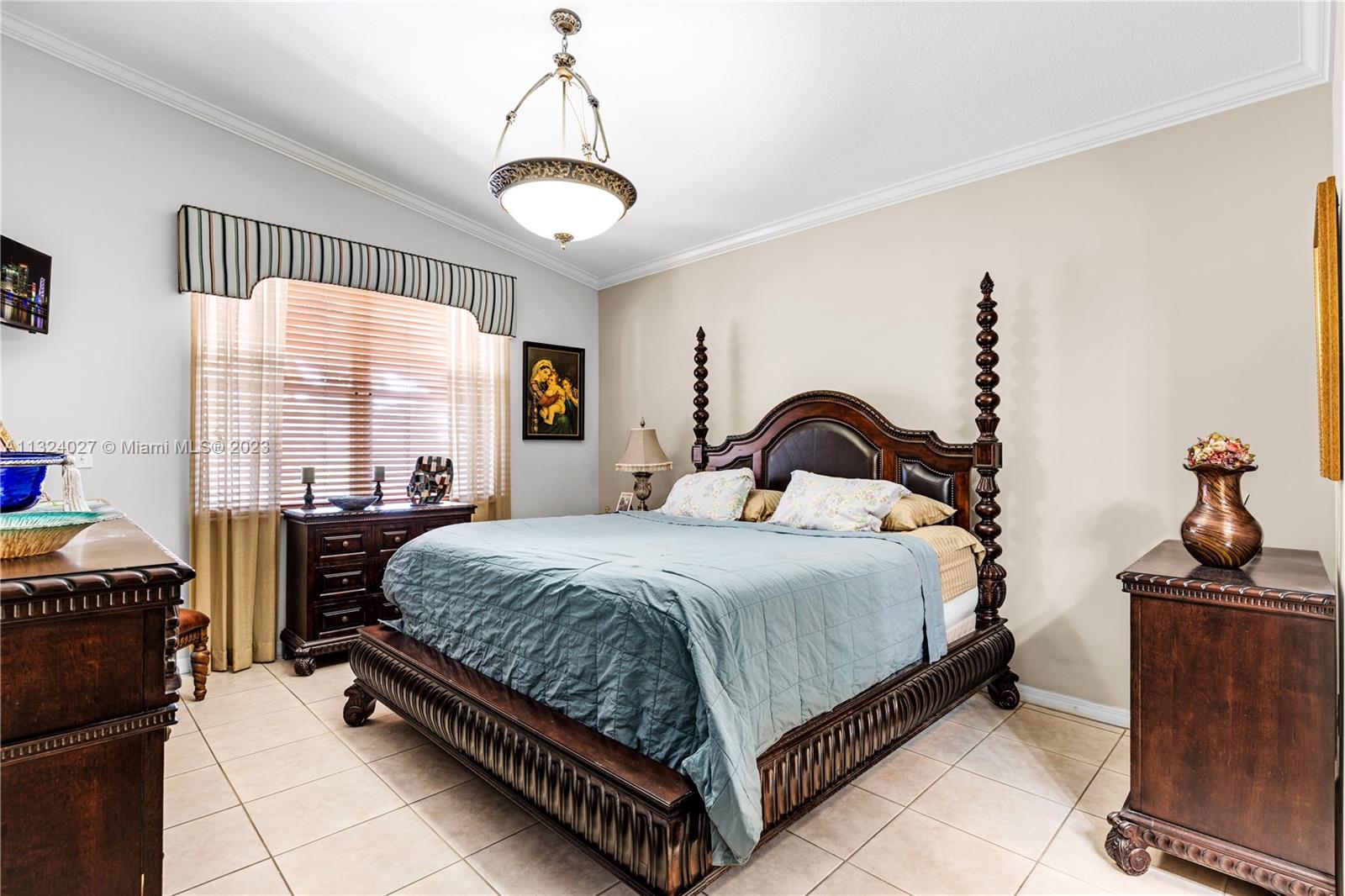 16056 Southwest 66th Terrace Miami, FL 33193 - Photo 10 of 24 a bedroom with a bed and a window