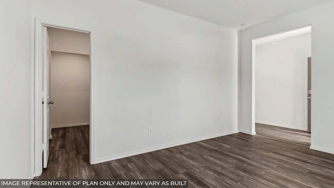 14565 Sunny Pl Drive Splendora, TX 77372 - Photo 19 of 30 a view of an empty room with wooden floor and closet