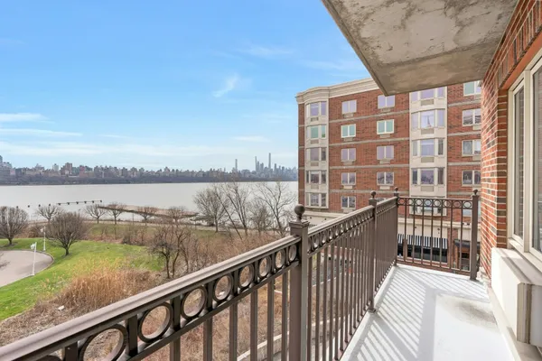a view of balcony with outdoor space and river