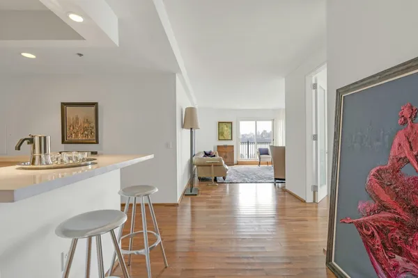 a dining room with furniture and wooden floor