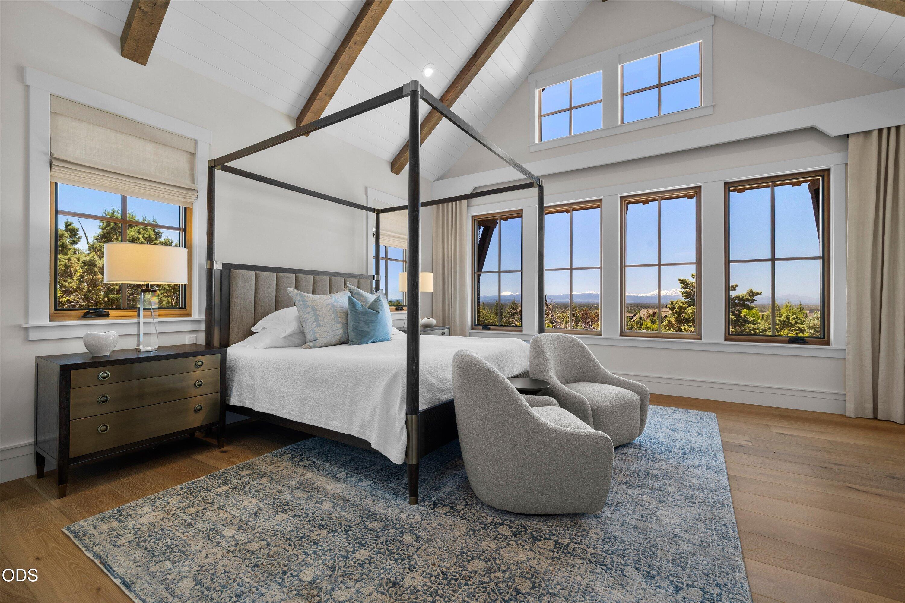 16215 South W Vaqueros Way Powell Butte, OR 97753 - Photo 16 of 48 The primary bedroom is framed around stunning, panoramic Cascade Mountain views
