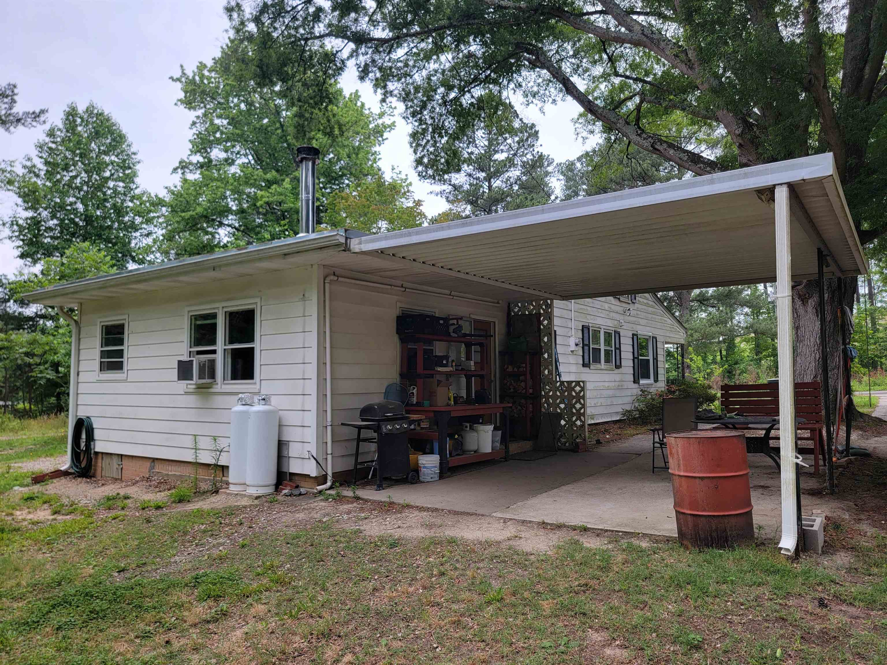 3217 Rowena Avenue Durham, NC 27703 - Photo 16 of 30 a view of a house with a backyard and chairs