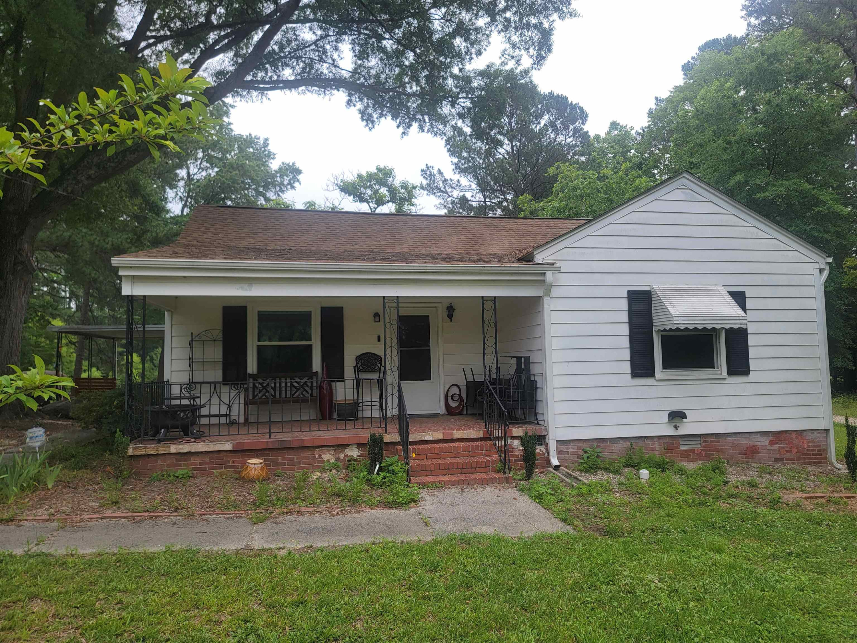 3217 Rowena Avenue Durham, NC 27703 - Photo 20 of 30 a front view of house with yard and outdoor seating