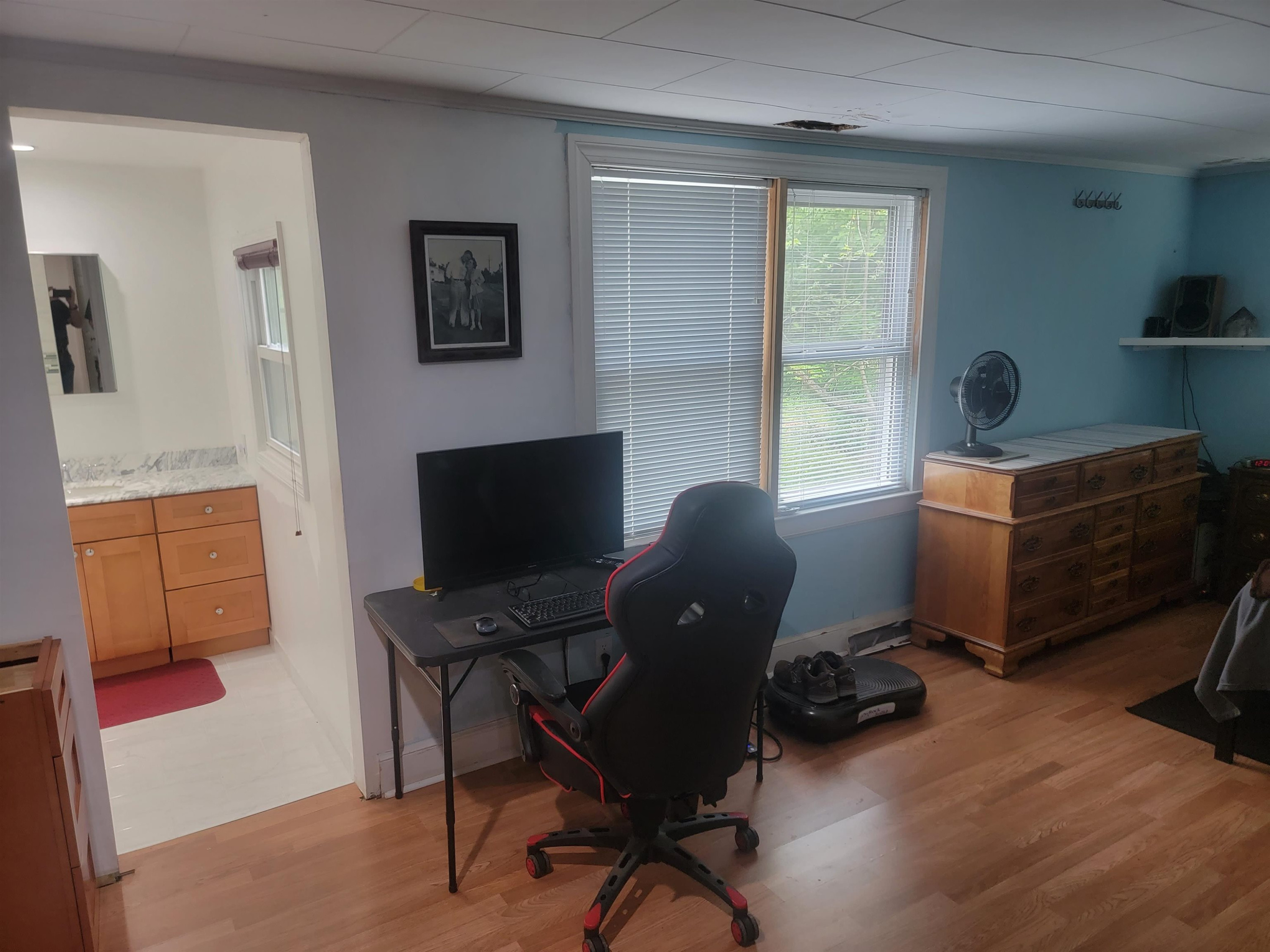 3217 Rowena Avenue Durham, NC 27703 - Photo 25 of 30 a view of a workspace with furniture and a window