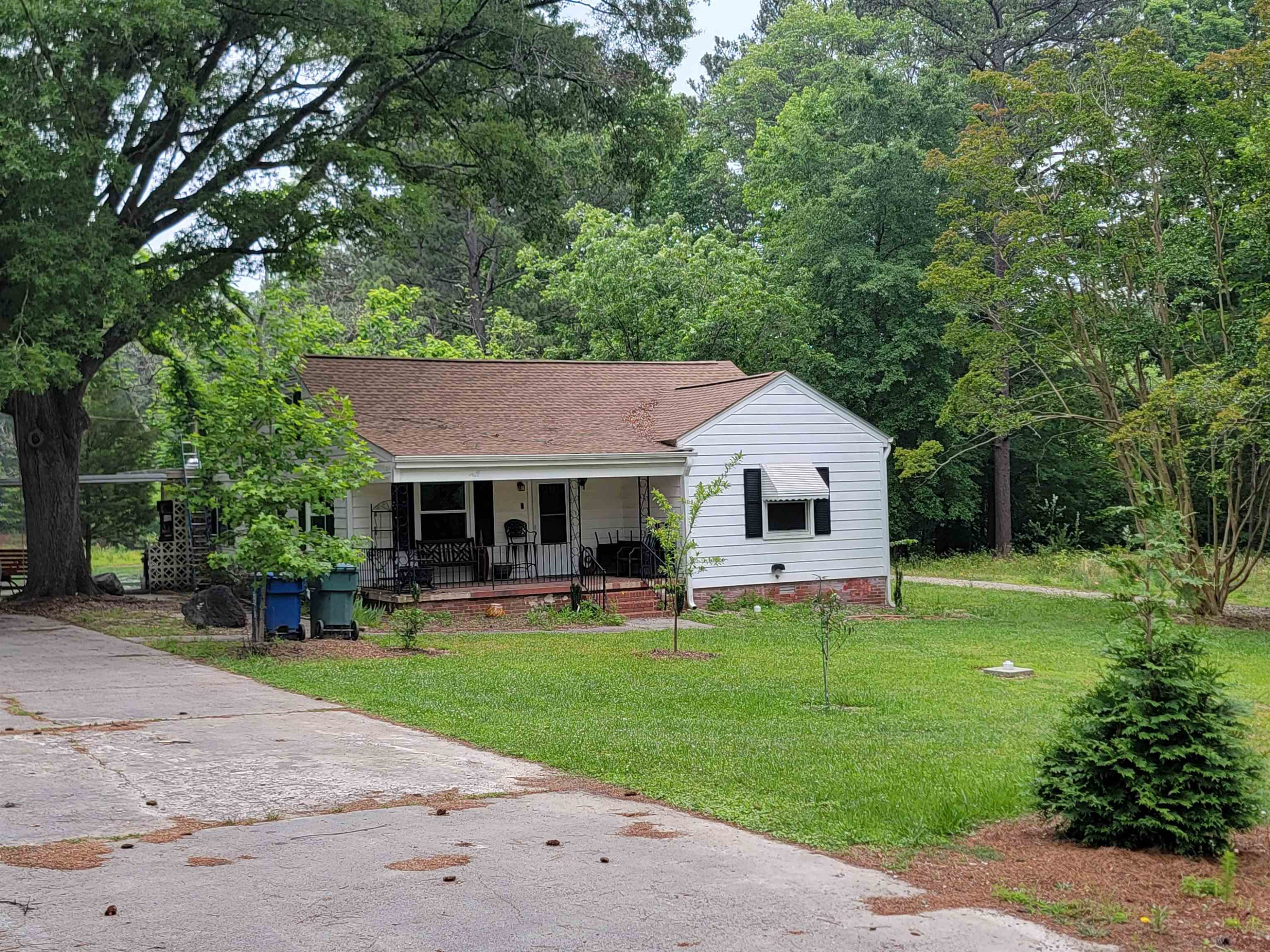 3217 Rowena Avenue Durham, NC 27703 - Photo 30 of 30 a view of a house with a yard and sitting area
