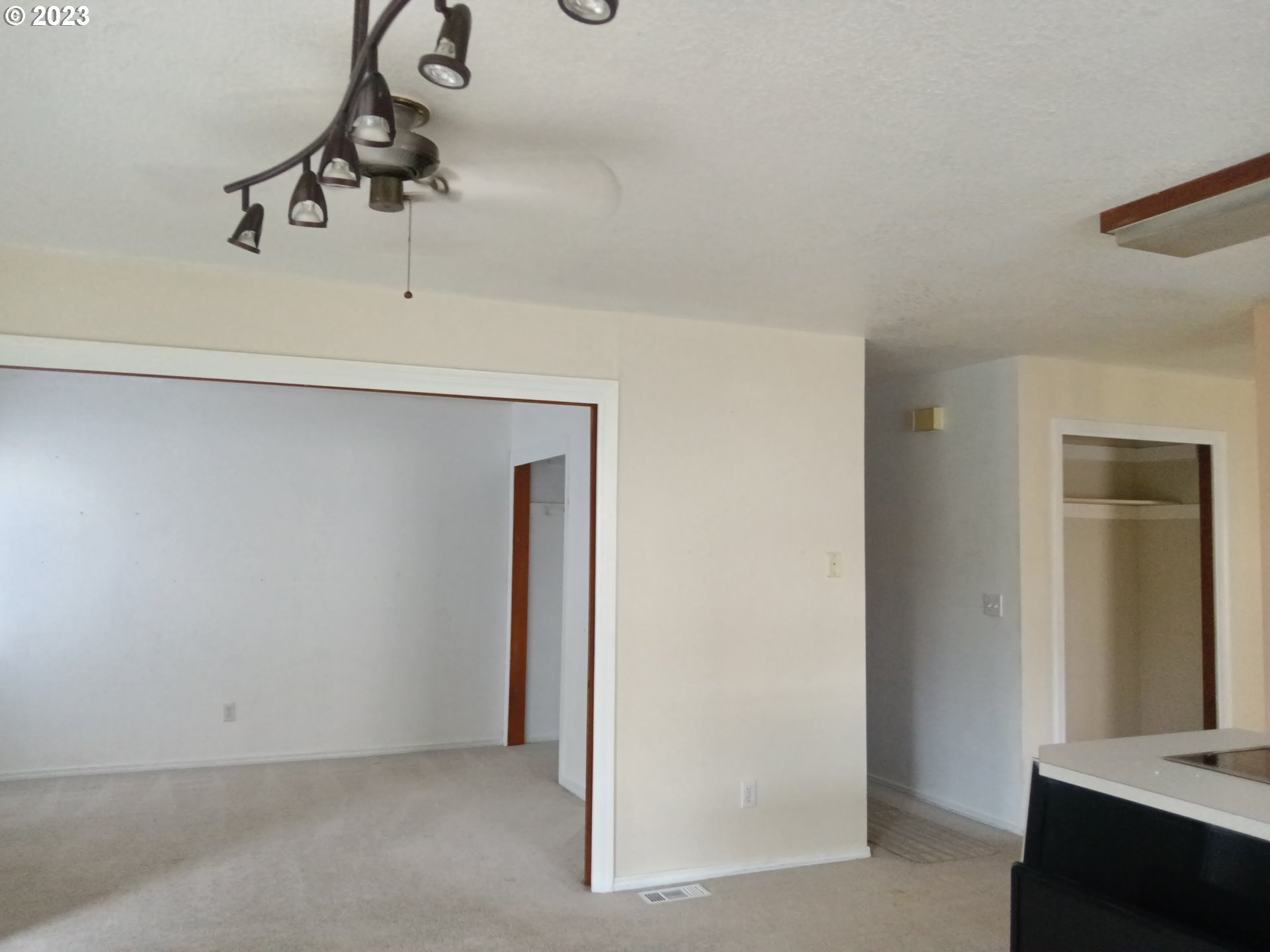 12998 Southwest Gentry Lane Beaverton, OR 97005 - Photo 12 of 22 a view of a room with rack on the wall