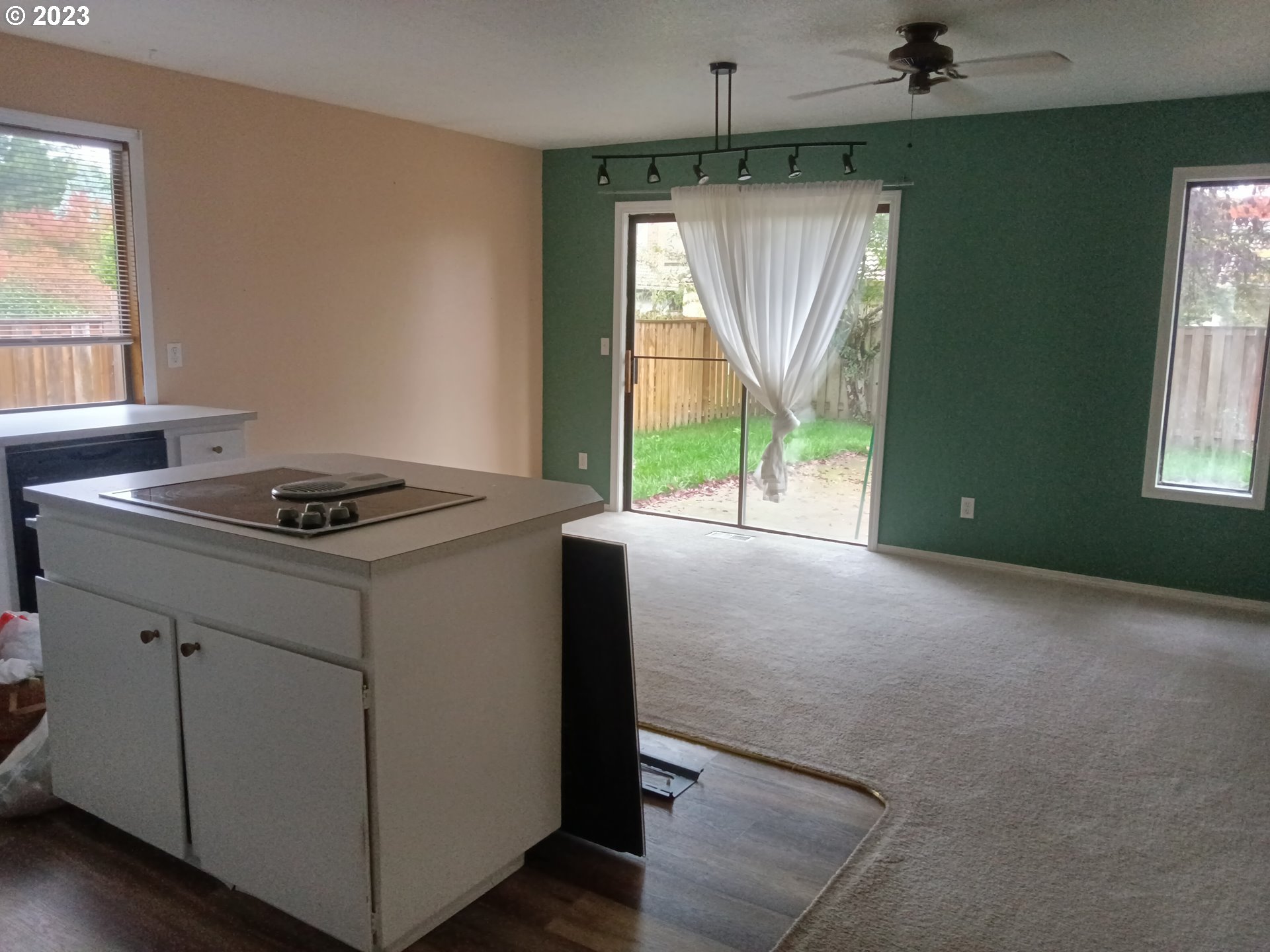 12998 Southwest Gentry Lane Beaverton, OR 97005 - Photo 16 of 22 an empty room with a window and a chandelier