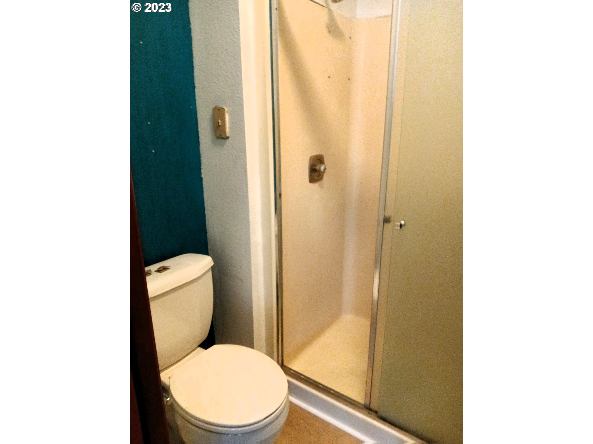 12998 Southwest Gentry Lane Beaverton, OR 97005 - Photo 20 of 22 a white toilet sitting next to a shower