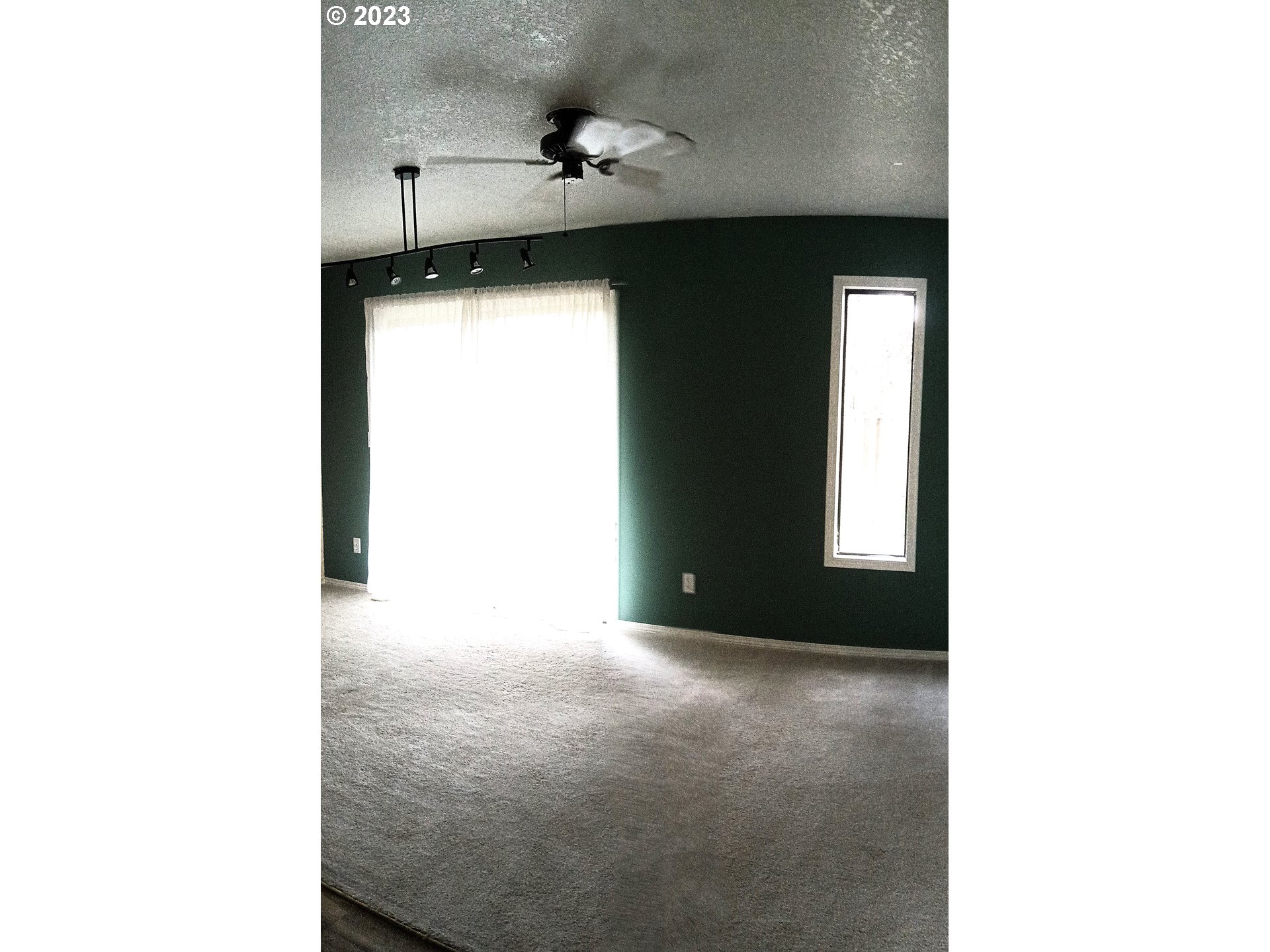 12998 Southwest Gentry Lane Beaverton, OR 97005 - Photo 21 of 22 a view of an empty room with a window