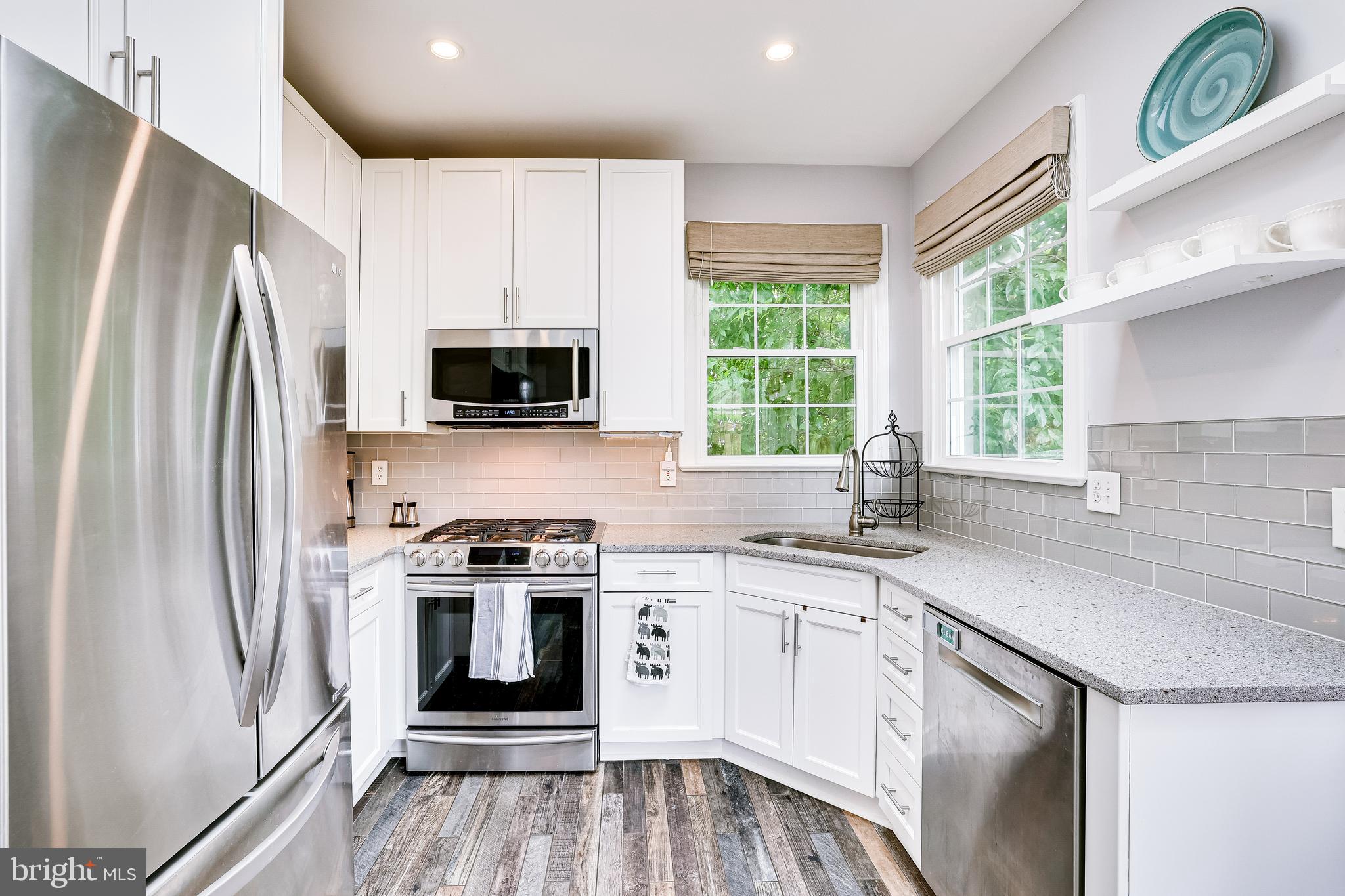 1369 Park Garden Lane Reston, VA 20194 - Photo 12 of 46 Featuring white cabinets, SS appl. and Quartz