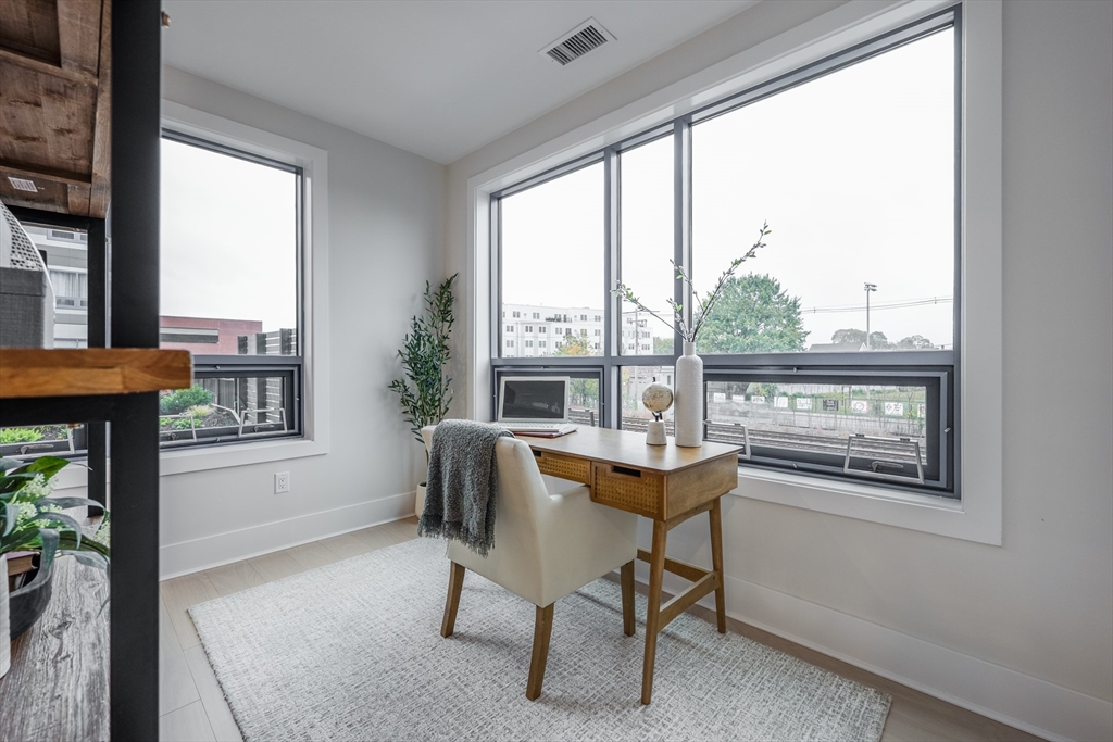 62 Foundry Street, Unit 202 Wakefield, MA 01880 - Photo 7 of 18 a workspace with furniture and a window