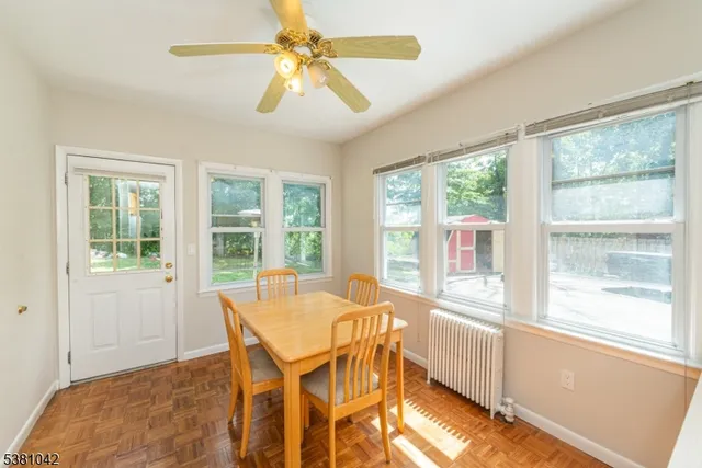 a view of a dining room with furniture window and outside view