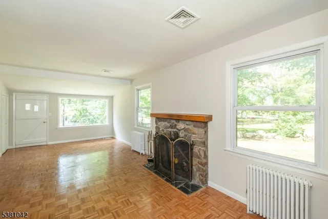 a view of livingroom with furniture and a fireplace