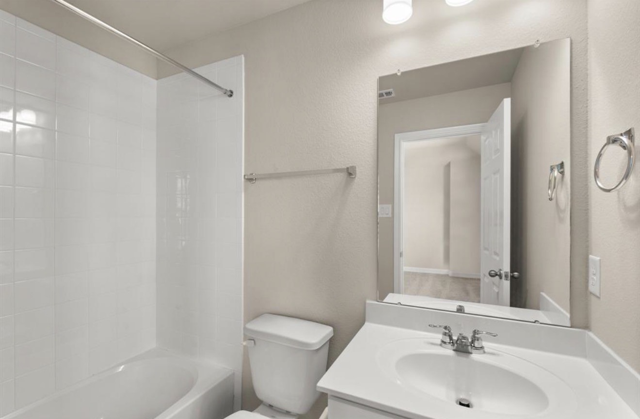 2912 Cliff Ridge Lane Katy, TX 77493 - Photo 17 of 36 a bathroom with a sink toilet and shower