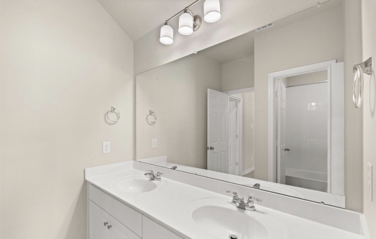 2912 Cliff Ridge Lane Katy, TX 77493 - Photo 19 of 36 a bathroom with a sink and a mirror