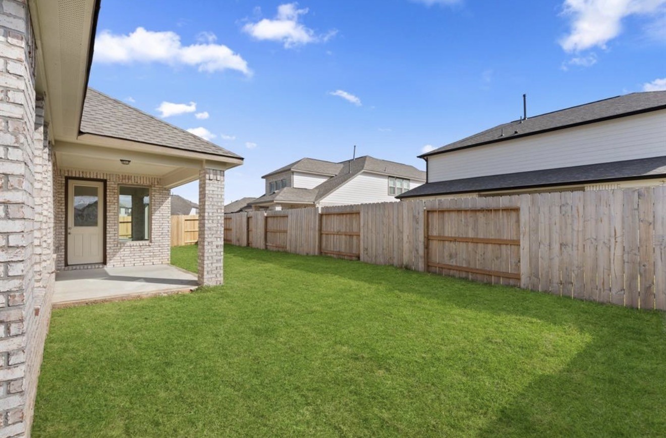 2912 Cliff Ridge Lane Katy, TX 77493 - Photo 22 of 36 a view of a house with backyard and garden