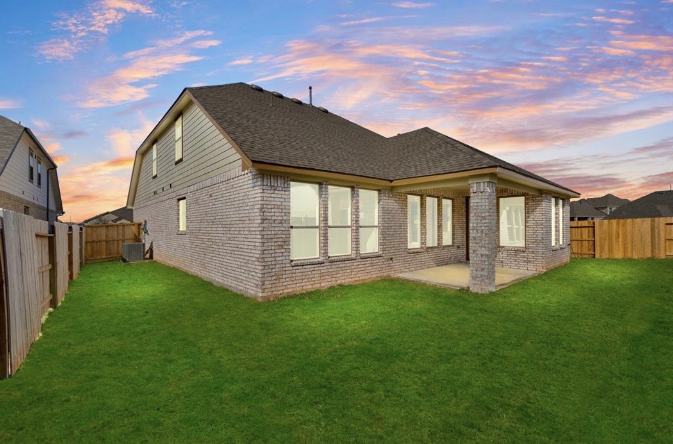 2912 Cliff Ridge Lane Katy, TX 77493 - Photo 24 of 36 a view of a house with a big yard potted plants and large tree