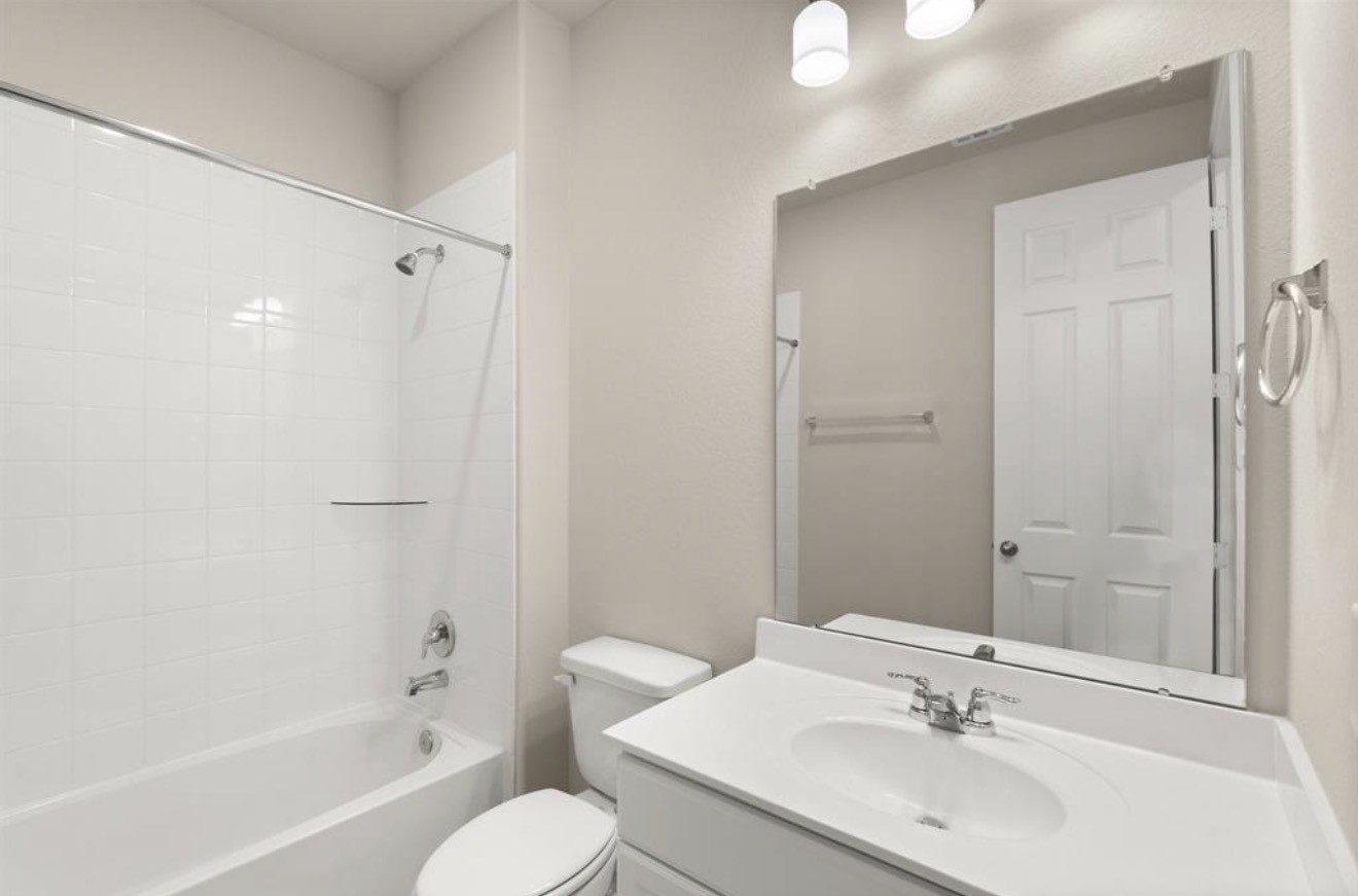 2912 Cliff Ridge Lane Katy, TX 77493 - Photo 5 of 36 a bathroom with a sink toilet tub and shower