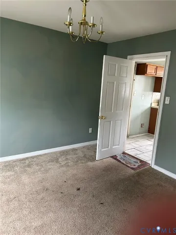 an empty room with wooden floor