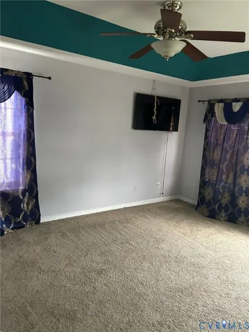 a view of a livingroom with furniture and chandelier