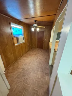 a view of a hallway with paintings on the walls